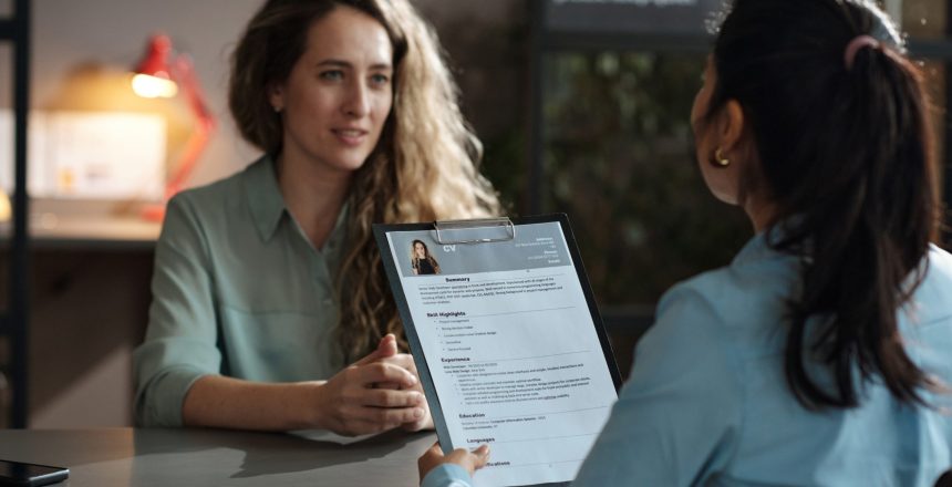 businesswoman-examining-resume-of-candidate-2022-04-27-01-51-18-utc (1)