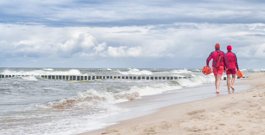 lifeguards go and watching people in the water. Poland